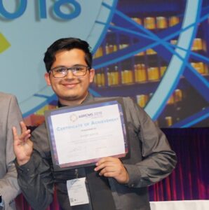 Joseph Garcia with certificate of acheivment