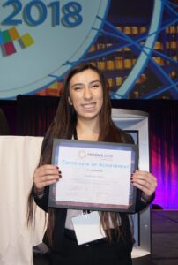 Nathalie Iribe posing with certificate